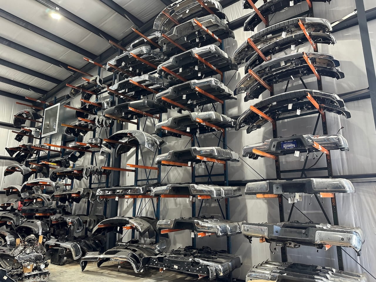 Bumpers for sale, organized in racks
